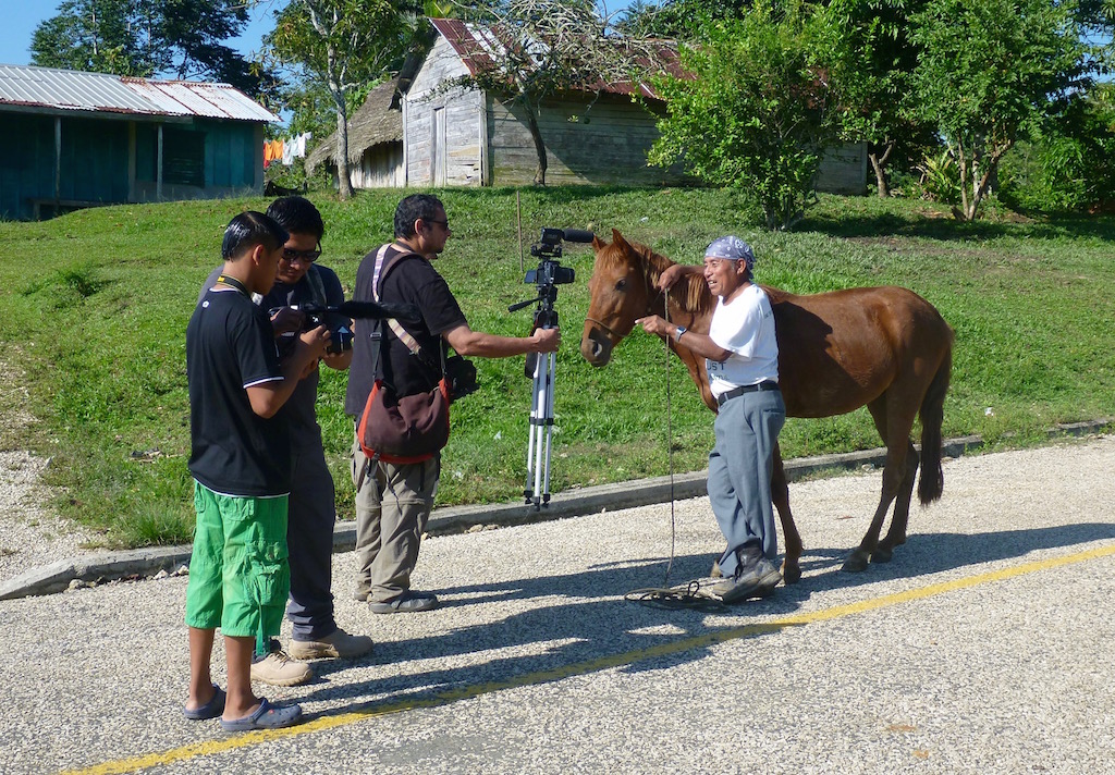 The documentary crew interviews Pedro Pop